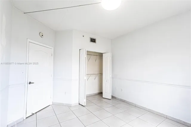 a view of an empty room with window