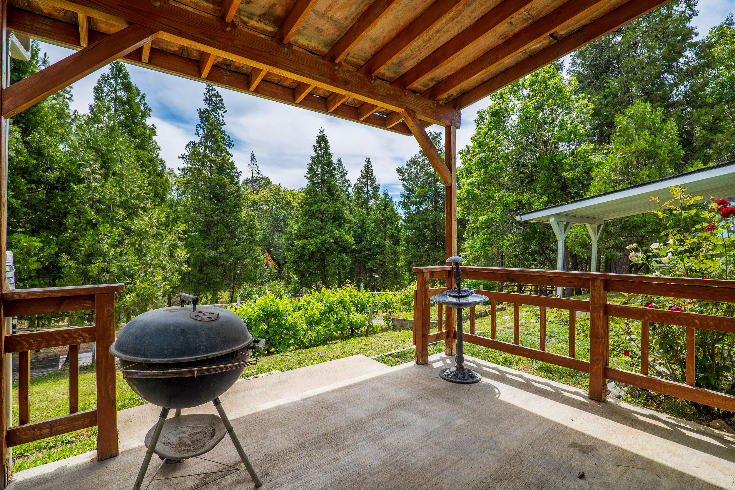 6801 Tunnel Loop Road Grants Pass, OR 97526 - Photo 34 of 40 a view of a porch with furniture and a yard