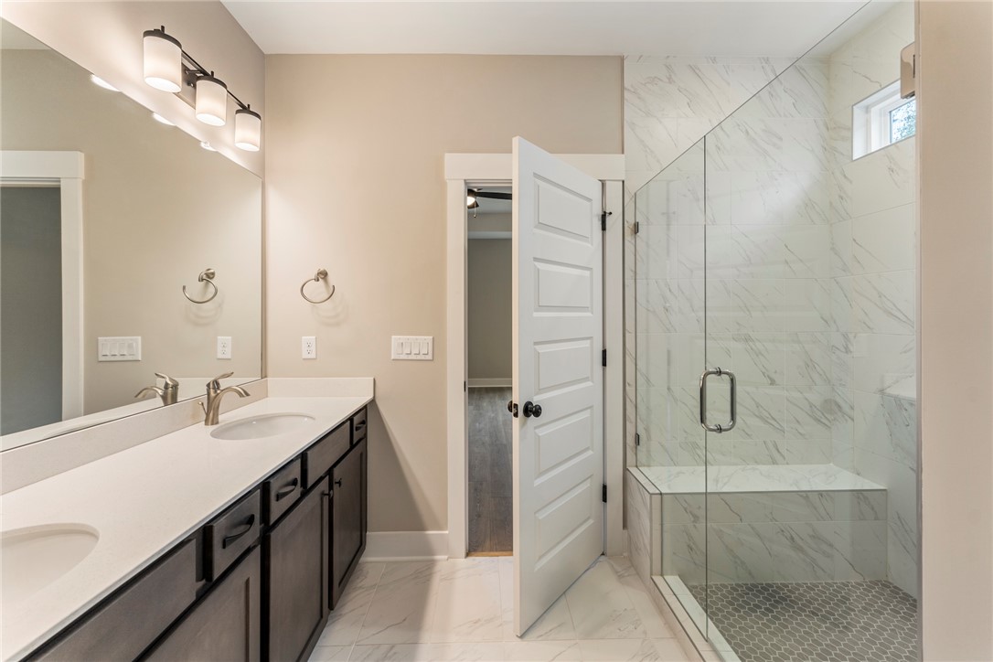 121 Falcon Crest Way Pickens, SC 29671 - Photo 12 of 13 This sleek bathroom features a double vanity and a spacious shower.