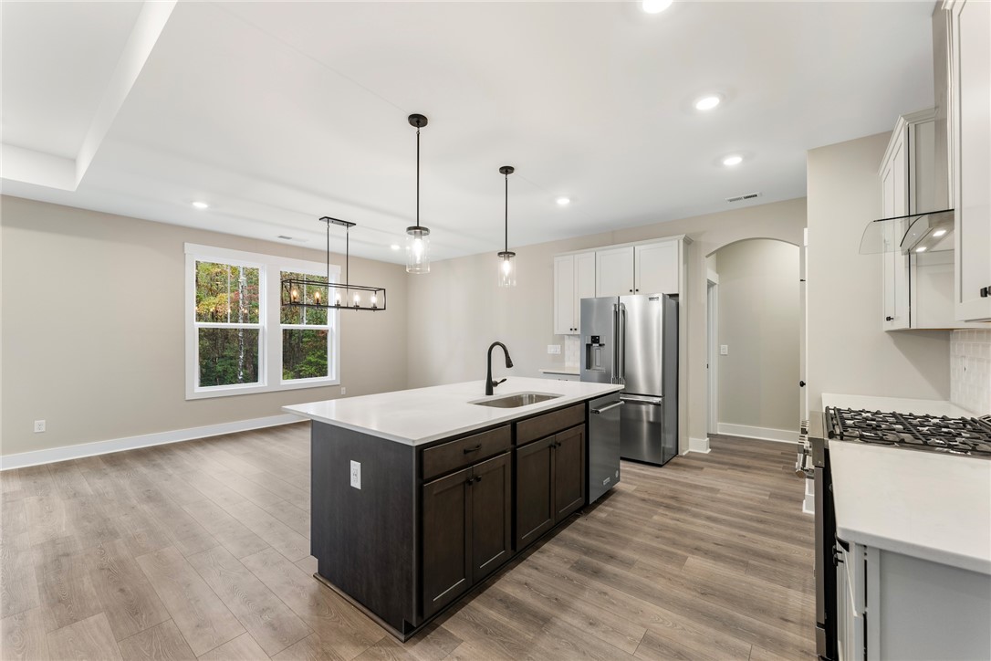 121 Falcon Crest Way Pickens, SC 29671 - Photo 13 of 13 This kitchen and dining area features an open floorplan with modern amenities and durable flooring.