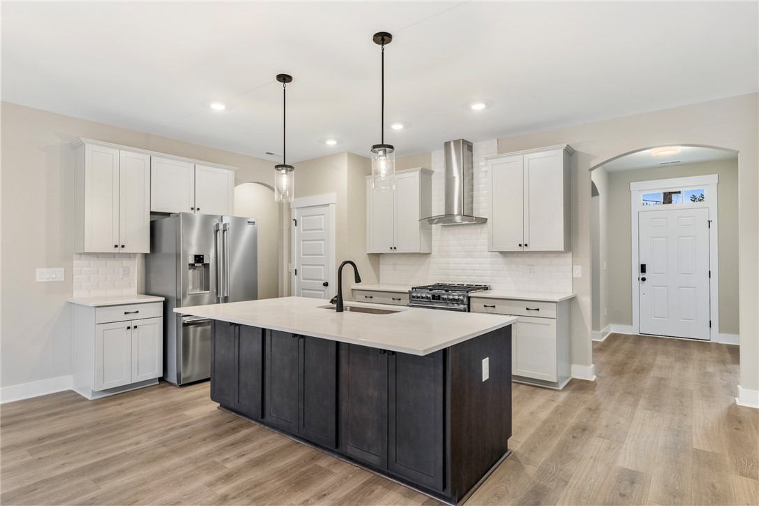 121 Falcon Crest Way Pickens, SC 29671 - Photo 3 of 13 This modern kitchen features a spacious island and contemporary appliances, perfect for everyday living.