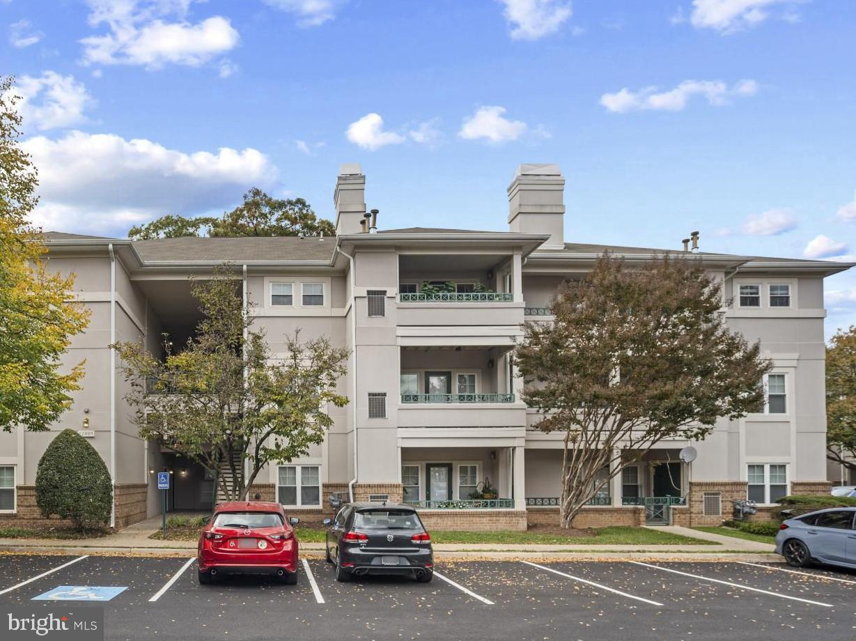 12005 Taliesin Place, Unit 16 Reston, VA 20190 - Photo 2 of 33 a car parked in front of a building