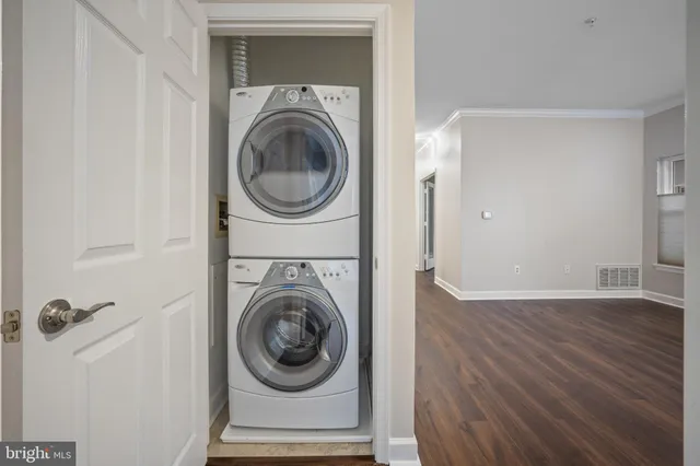 a view of a hallway with washer and dryer