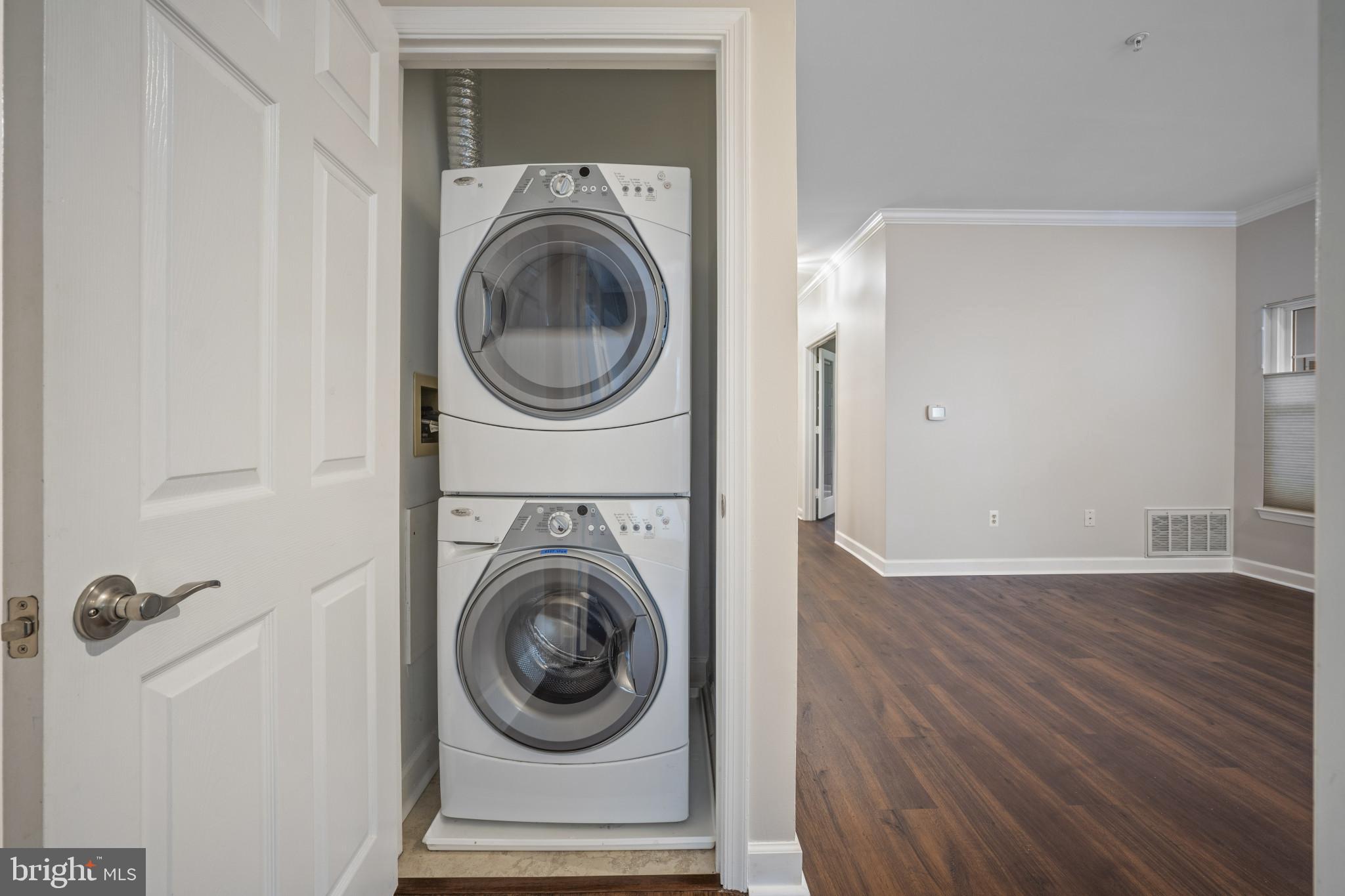 12005 Taliesin Place, Unit 16 Reston, VA 20190 - Photo 22 of 33 a view of a hallway with washer and dryer