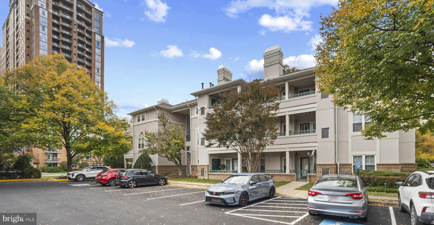 12005 Taliesin Place, Unit 16 Reston, VA 20190 - Photo 3 of 33 a car parked in front of a building