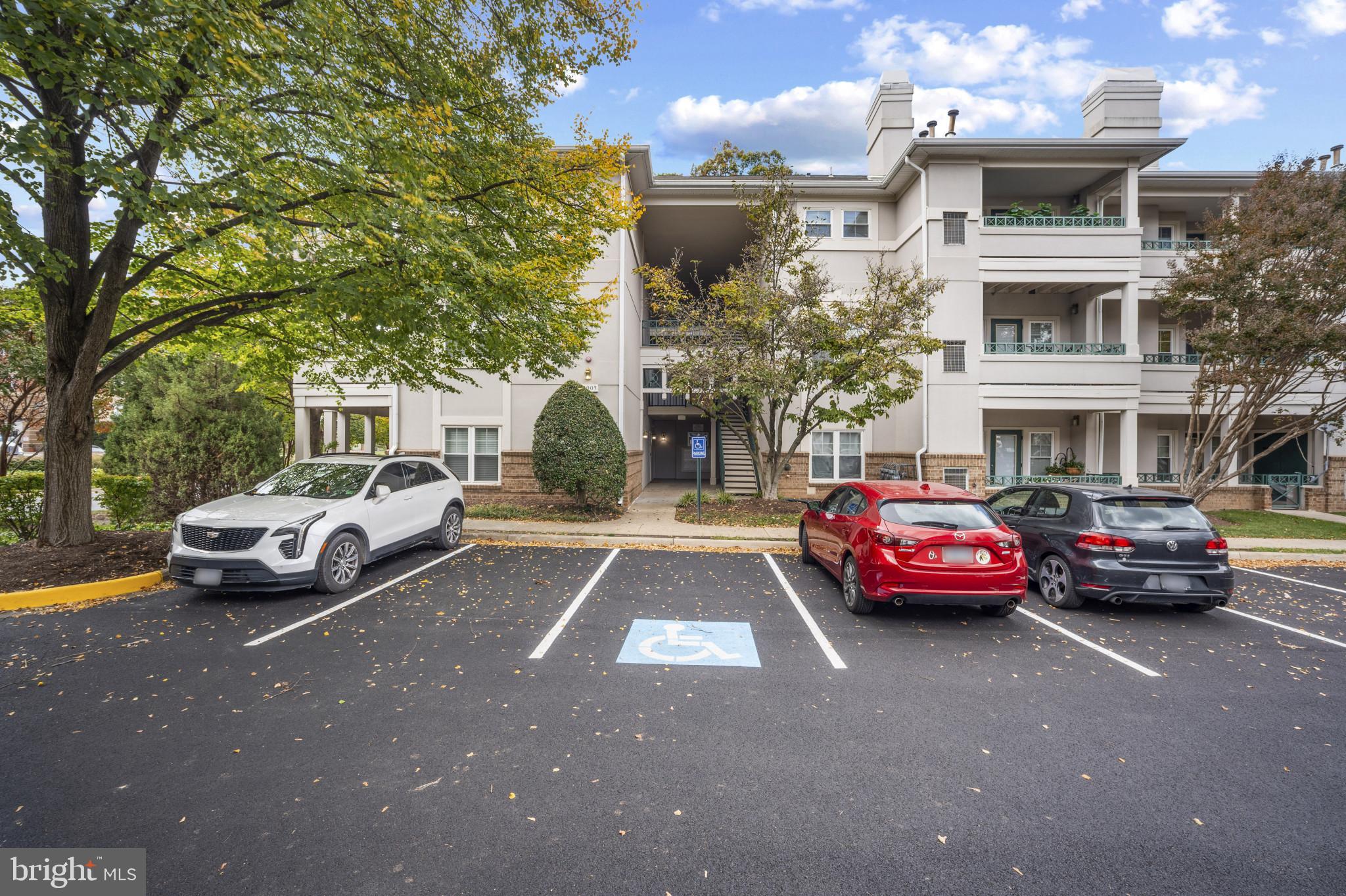 12005 Taliesin Place, Unit 16 Reston, VA 20190 - Photo 4 of 33 a view of street with parked cars