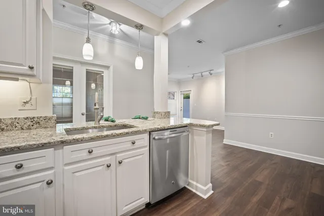 a spacious bathroom with a granite countertop sink and a mirror
