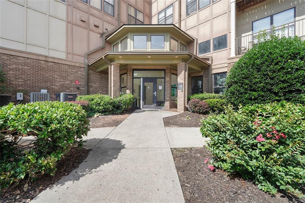 898 Oak Street Southwest, Unit 1105 Atlanta, GA 30310 - Photo 2 of 20 a view of a building with potted plants