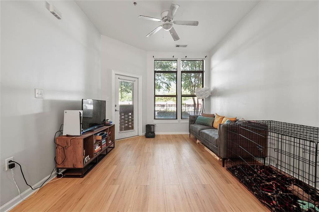 898 Oak Street Southwest, Unit 1105 Atlanta, GA 30310 - Photo 3 of 20 a living room with furniture fireplace and flat screen tv