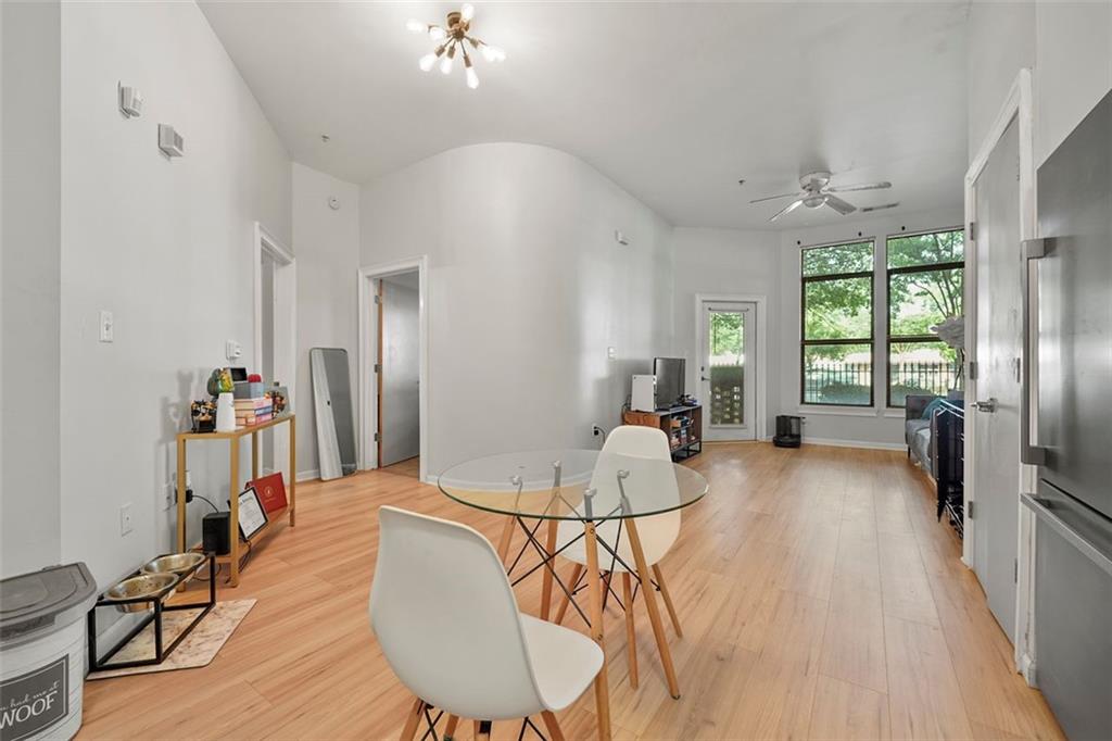 898 Oak Street Southwest, Unit 1105 Atlanta, GA 30310 - Photo 6 of 20 a view of a dining room with furniture window and wooden floor