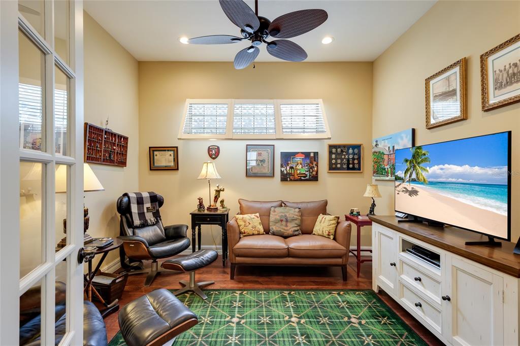 5011 Tobermory Way Bradenton, FL 34211 - Photo 24 of 77 a living room with furniture and a flat screen tv
