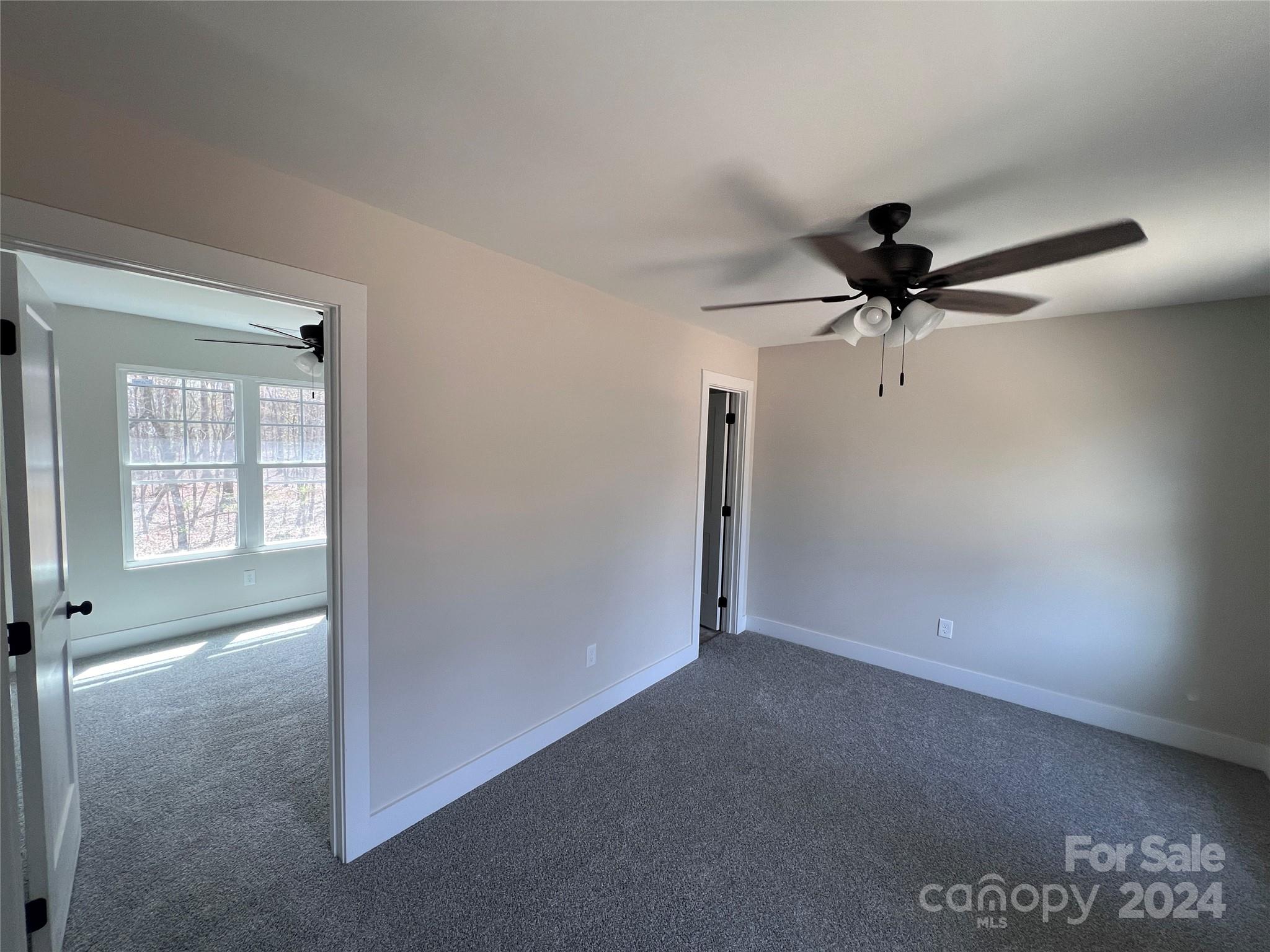 3610 Olive Branch Road Monroe, NC 28110 - Photo 11 of 15 a view of a livingroom with a ceiling fan and window