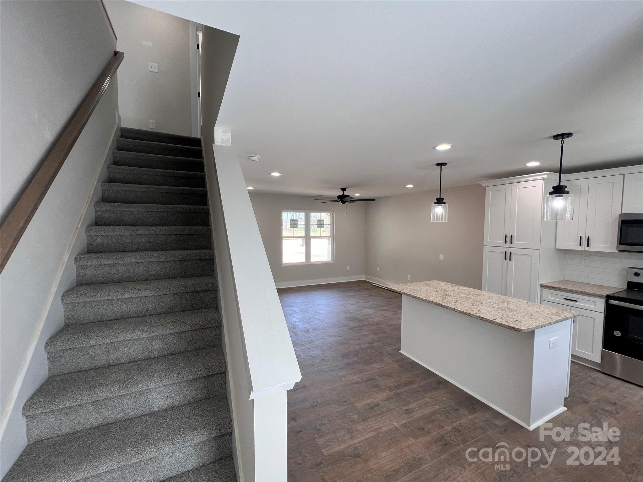 3610 Olive Branch Road Monroe, NC 28110 - Photo 4 of 15 a view of a kitchen with cabinets and wooden floor