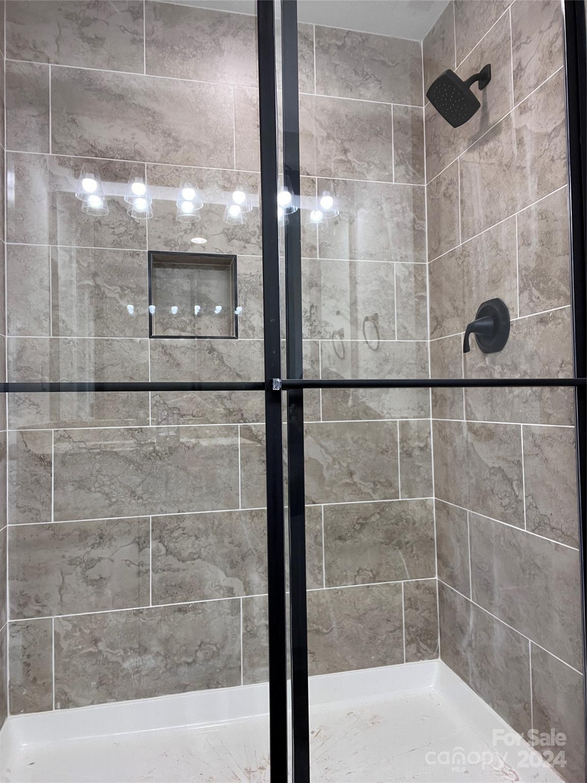 3610 Olive Branch Road Monroe, NC 28110 - Photo 7 of 15 a bathroom with a glass shower door