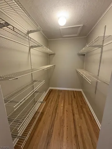 a view of a room with racks on the wall