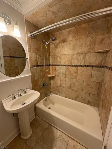 a bathroom with a sink and a bathtub