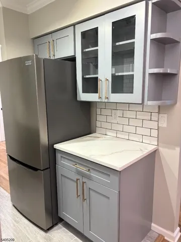 a kitchen with stainless steel appliances a refrigerator and a sink