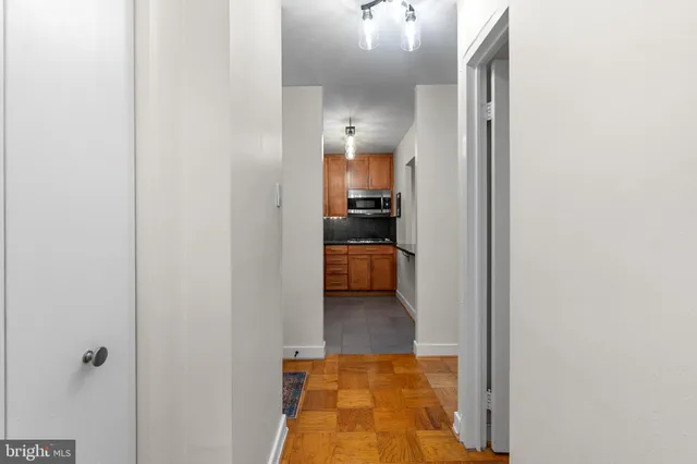 a view of a bedroom from a hallway