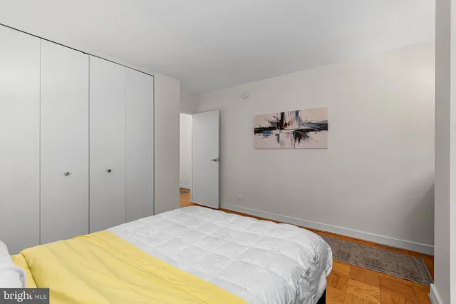 a bedroom with a bed and a table