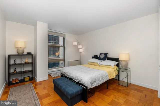 a bedroom with a bed and dresser