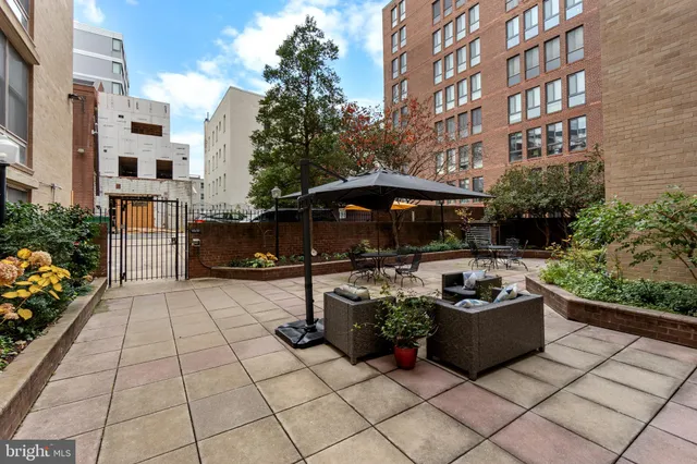a view of a building with sitting area