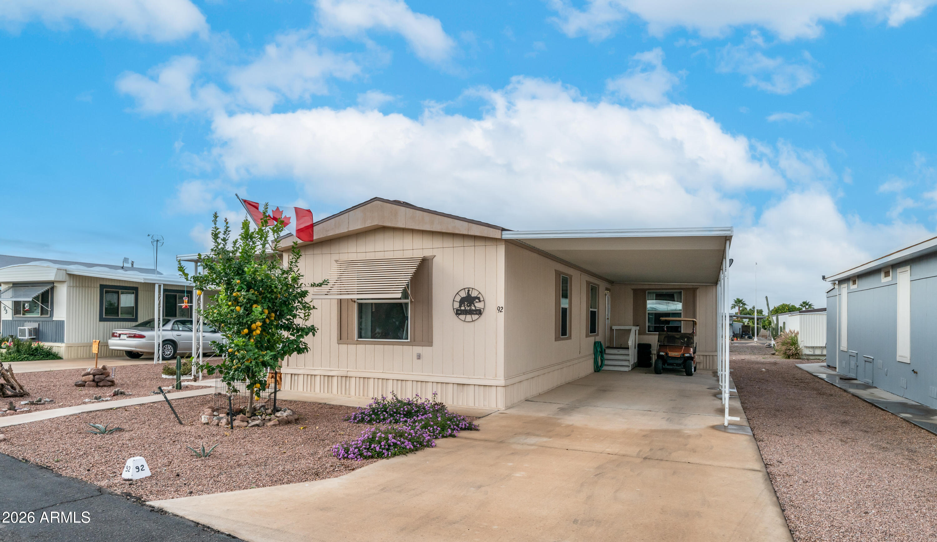747 East Germann Road, Unit 92 San Tan Valley, AZ 85140 - Photo 3 of 39 a front view of a house with garden