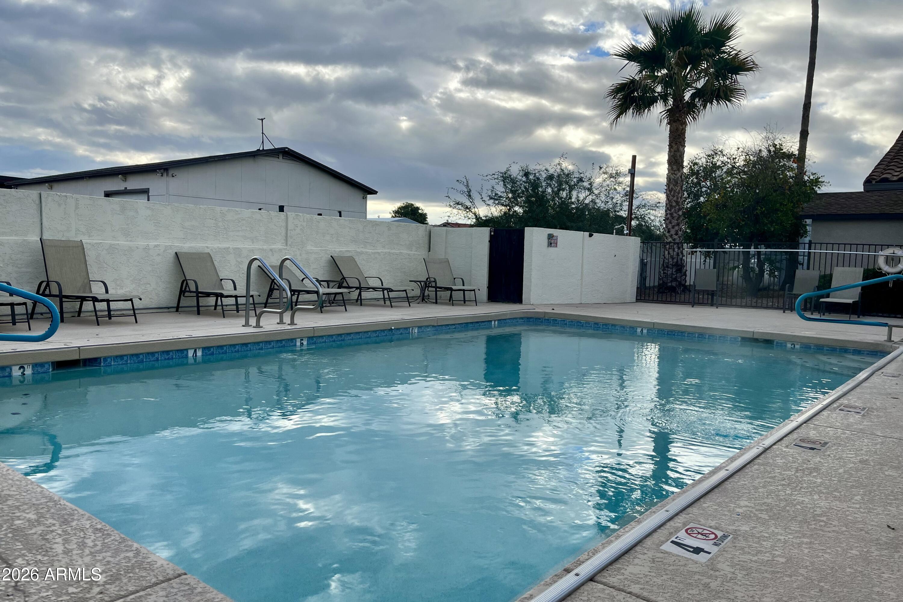 747 East Germann Road, Unit 92 San Tan Valley, AZ 85140 - Photo 33 of 39 a view of a house with swimming pool and sitting area