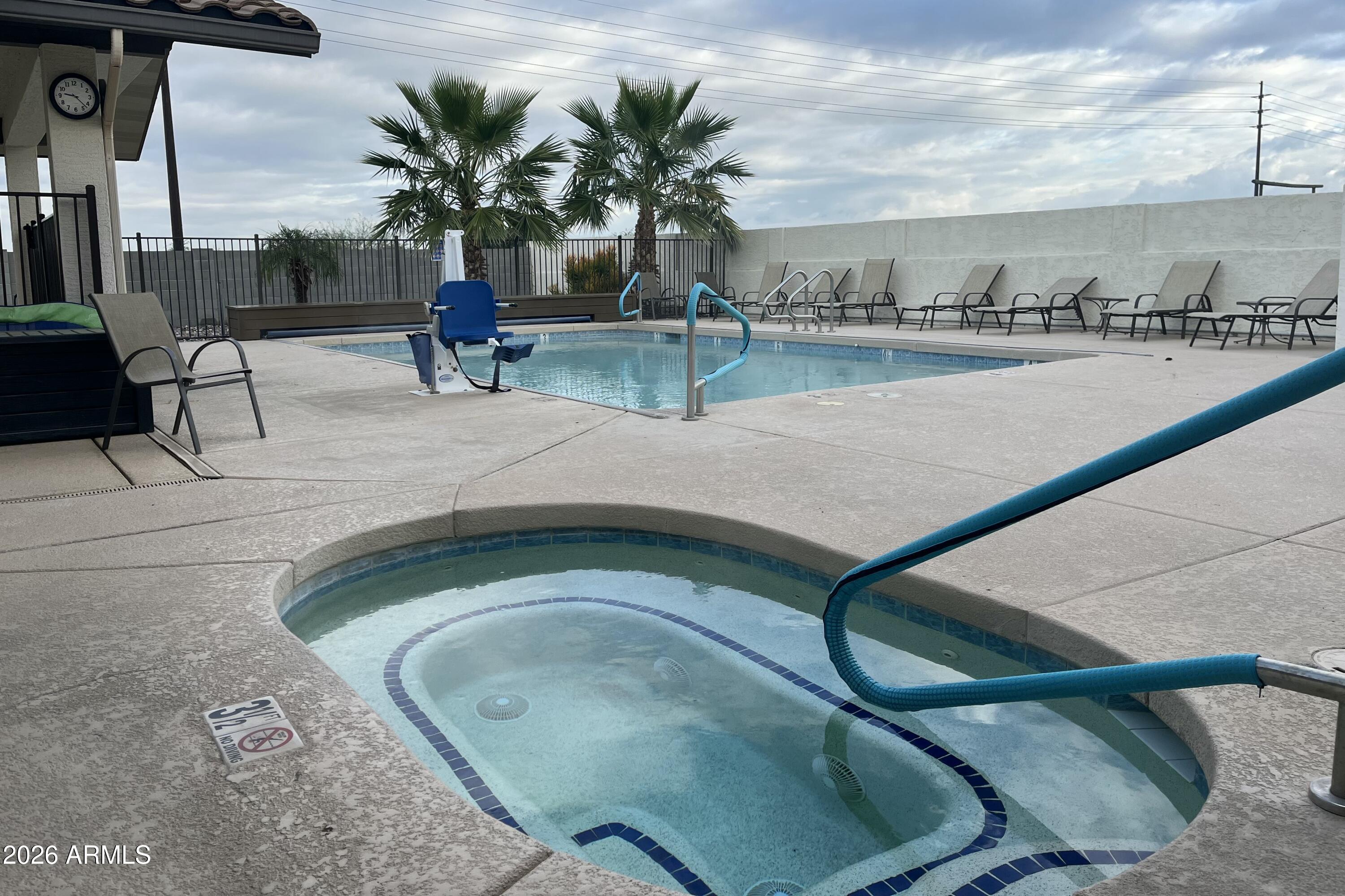 747 East Germann Road, Unit 92 San Tan Valley, AZ 85140 - Photo 34 of 39 a view of a swimming pool with outdoor seating