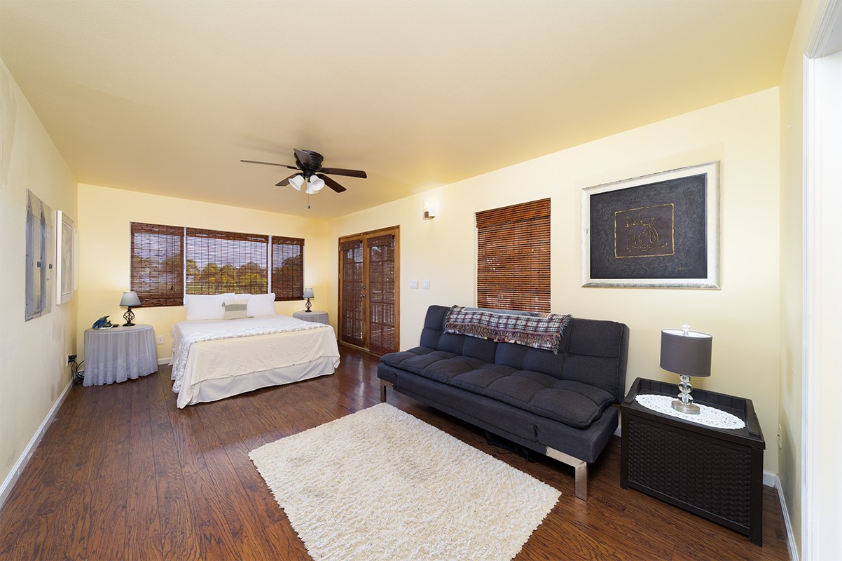28-380 Sugar Mill Road Pepeekeo, HI 96783 - Photo 11 of 29 a living room with furniture rug and wooden floor
