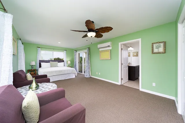 a view of a chairs and table in the balcony
