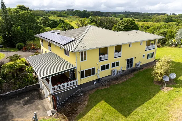a aerial view of a house with swimming pool