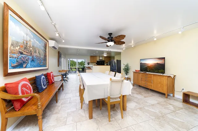 a kitchen with stainless steel appliances a stove a sink and a microwave