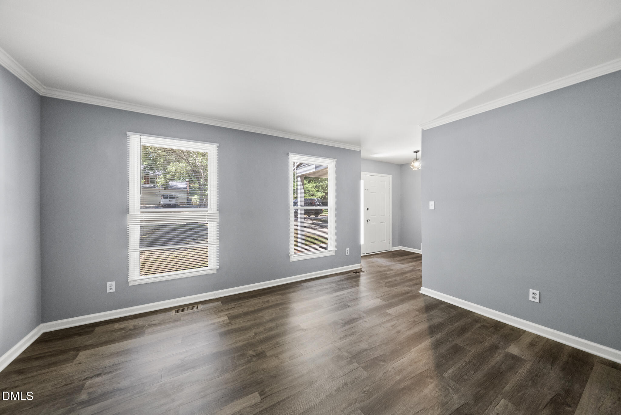 2108 Treverton Place Raleigh, NC 27609 - Photo 14 of 30 a view of an empty room with wooden floor and a window