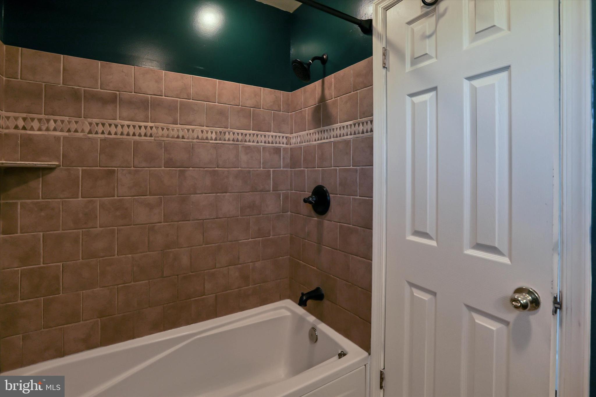 8314 Tinsley Road Baltimore, MD 21244 - Photo 18 of 44 a bathroom with a bathtub