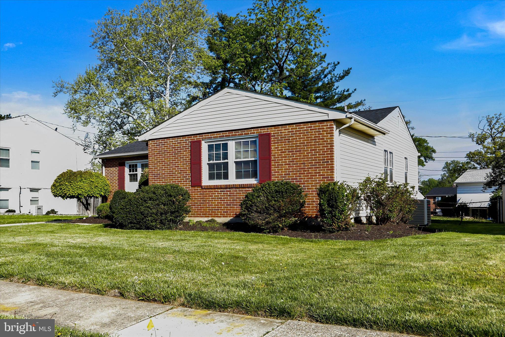 8314 Tinsley Road Baltimore, MD 21244 - Photo 3 of 44 a front view of a house with garden
