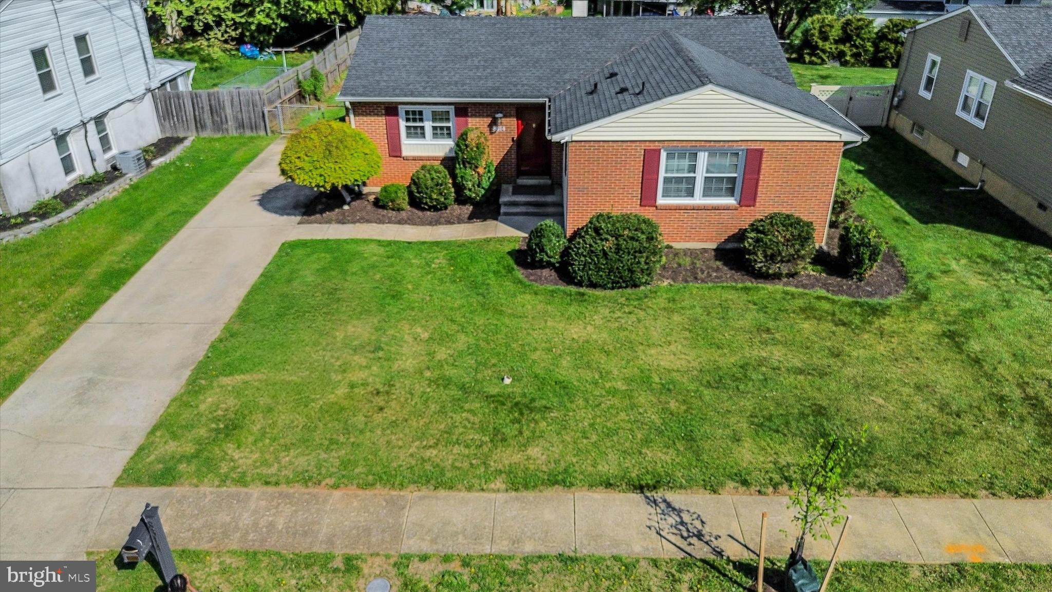 8314 Tinsley Road Baltimore, MD 21244 - Photo 34 of 44 a front view of a house with a yard