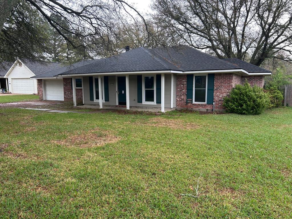 10127 Freedoms Way Keithville, LA 71047 - Photo 1 of 14 a view of a yard in front of a house