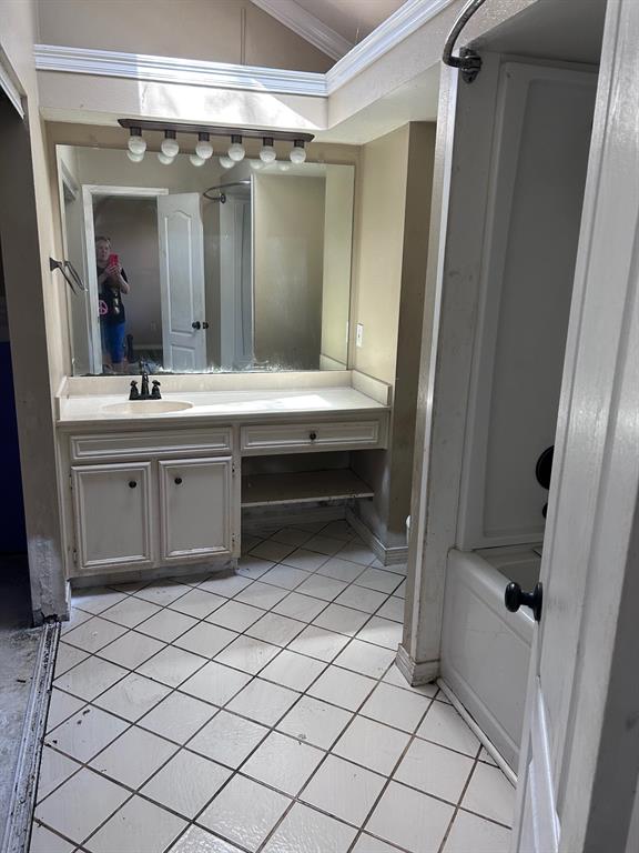 10127 Freedoms Way Keithville, LA 71047 - Photo 11 of 14 a bathroom with a sink and a mirror