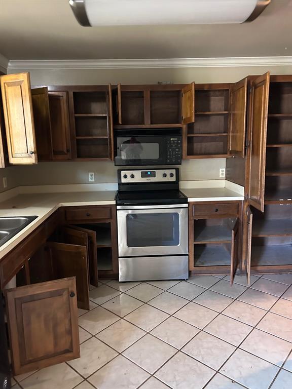 10127 Freedoms Way Keithville, LA 71047 - Photo 5 of 14 a kitchen with granite countertop a stove and a microwave
