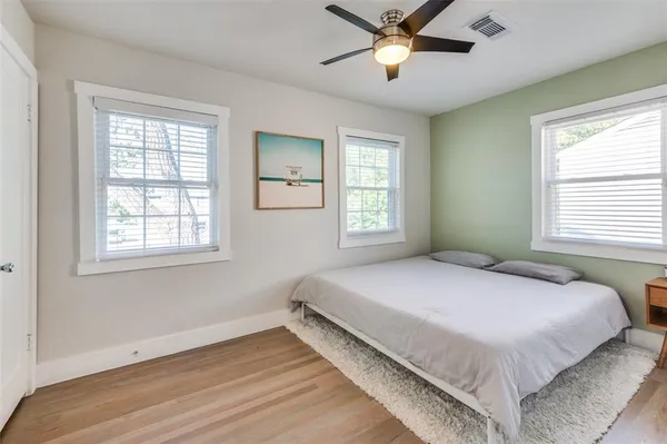 a bedroom with a bed and window