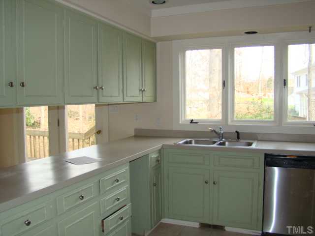 4516 Wellington Downs Raleigh, NC 27613 - Photo 10 of 18 a kitchen with sink and window