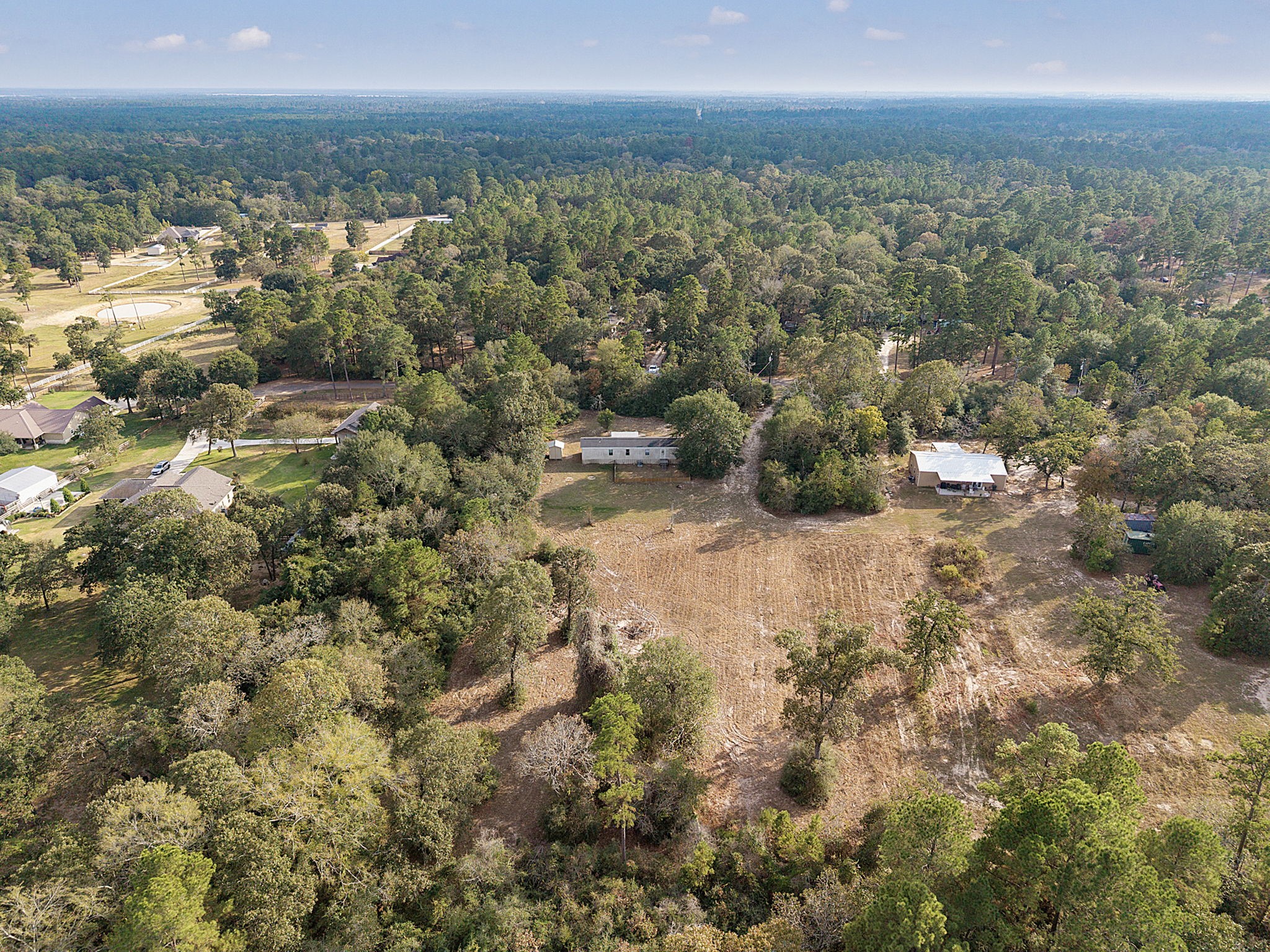 6493 Pappas Road Waller, TX 77484 - Photo 26 of 28 High-elevation aerial capturing uninterrupted forest views and the expansive natural landscape surrounding the property.
This perspective underscores long-term land value, minimal density, and the increasingly rare opportunity to own acreage within the growth path of the US-290 corridor.