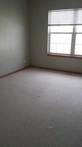 2474 Golf Ridge Circle, Unit 2474 Naperville, IL 60563 - Photo 13 of 16 an empty room with a window