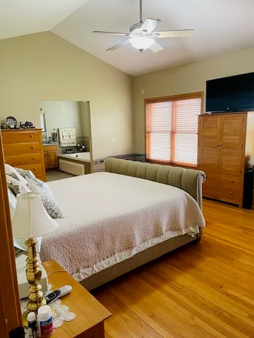 a bedroom with bed and window