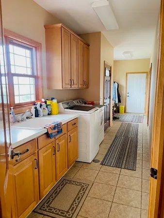 a kitchen with a sink and wooden cabinets
