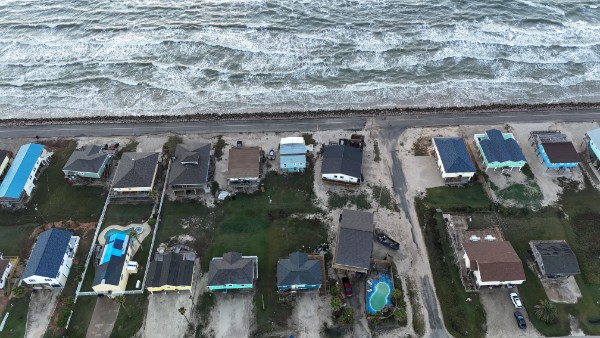 415 Seashell Drive Surfside Beach, TX 77541 - Photo 4 of 10 Aerial view of property's location with a nearby body of water