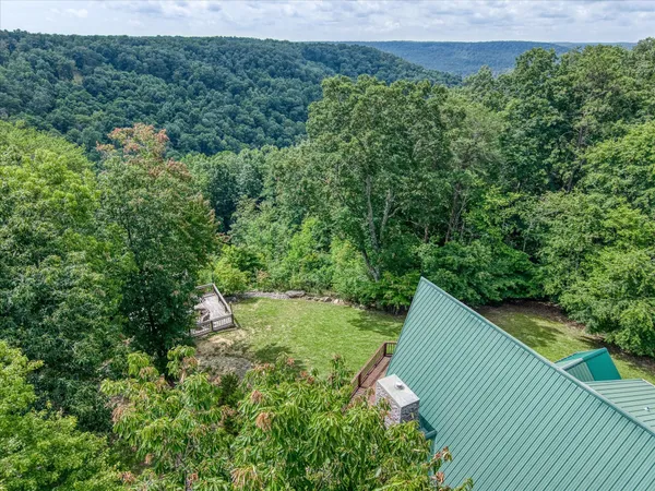 an aerial view of residential house with outdoor space