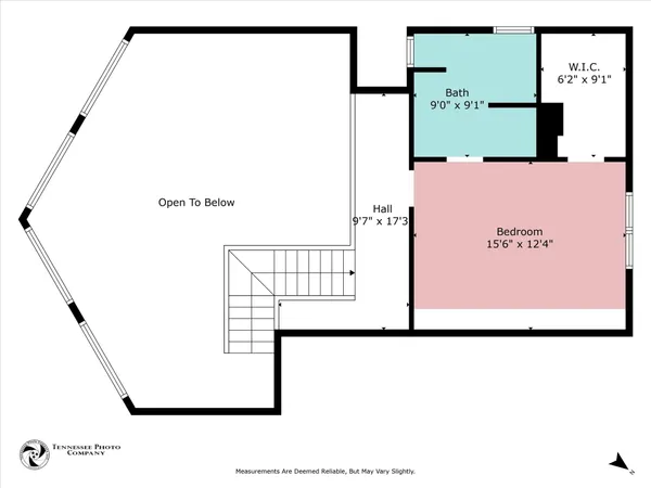 a view of a house with a wall