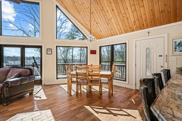 a view of living room filled with furniture and wooden floor