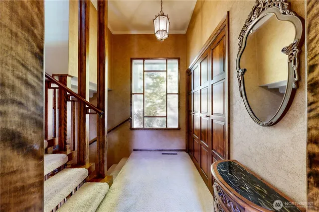 a view of a room with wooden floor